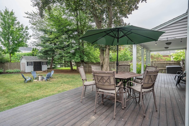 11 Craigmoor Rd, West Hartford, CT 06107 - wooden deck with a fenced backyard, outdoor dining area, and a storage unit