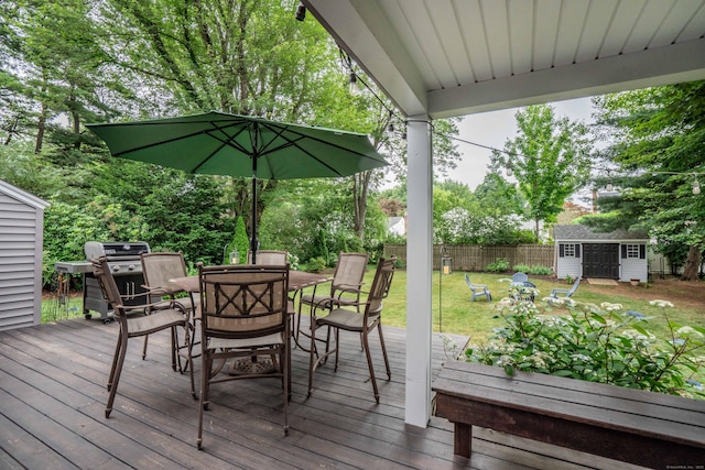 11 Craigmoor Rd, West Hartford, CT 06107 - deck featuring outdoor dining space, a shed, a grill, and view of wooded area
