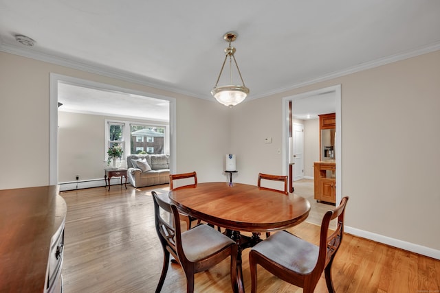 112 Shadow Ln, West Hartford, CT 06110 - dining area with a baseboard heating unit, ornamental molding, and light wood-type flooring