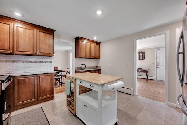 112 Shadow Ln, West Hartford, CT 06110 - kitchen with a baseboard radiator, decorative backsplash, recessed lighting, and light tile patterned floors