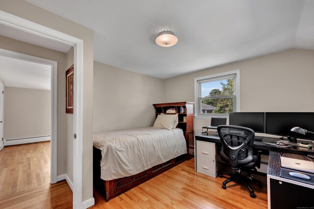 112 Shadow Ln, West Hartford, CT 06110 - bedroom featuring a baseboard heating unit, light wood-type flooring, a desk, and vaulted ceiling