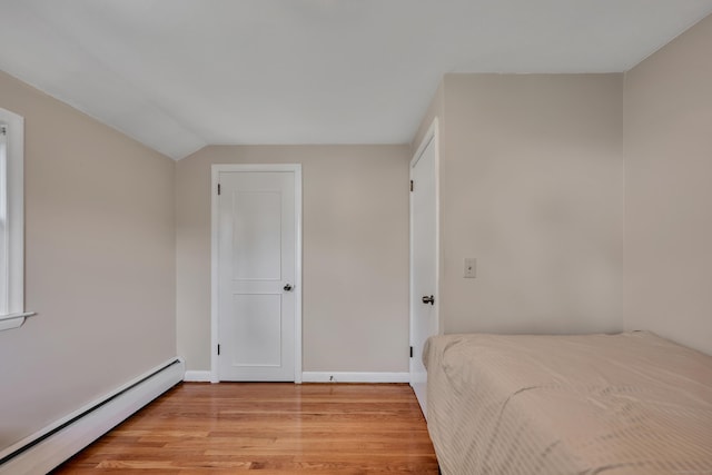 112 Shadow Ln, West Hartford, CT 06110 - bedroom featuring baseboard heating and light wood finished floors
