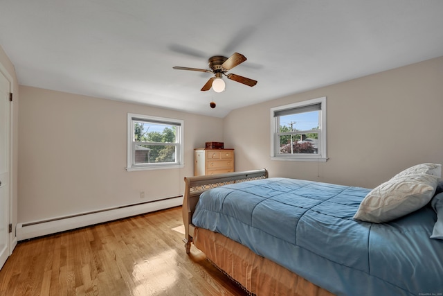 112 Shadow Ln, West Hartford, CT 06110 - bedroom with a baseboard radiator, multiple windows, light wood-style floors, and ceiling fan