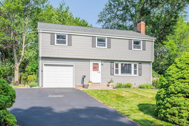 112 Shadow Ln, West Hartford, CT 06110 - colonial house with a garage, a chimney, a front lawn, and asphalt driveway