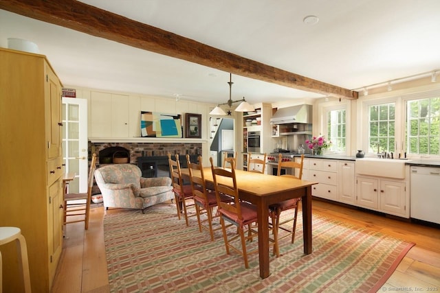 12 Popple Swamp Rd, Cornwall, CT 06754 - dining space featuring beam ceiling, a fireplace, and wood finished floors