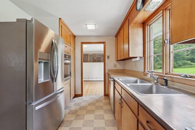 1 Old Middle Rd, New Milford, CT 06776 - kitchen with stainless steel appliances, light floors, baseboard heating, and brown cabinetry
