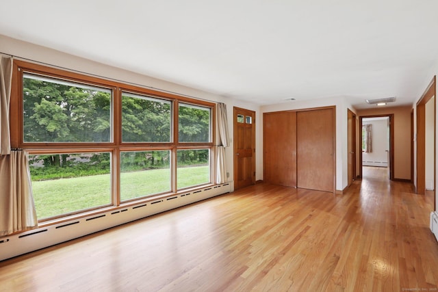 1 Old Middle Rd, New Milford, CT 06776 - unfurnished living room with baseboard heating and light wood finished floors