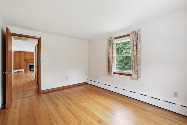 1 Old Middle Rd, New Milford, CT 06776 - empty room with a baseboard heating unit, light wood-style flooring, and baseboard heating
