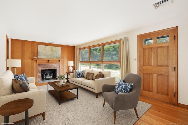 1 Old Middle Rd, New Milford, CT 06776 - living room featuring light wood-type flooring and a brick fireplace