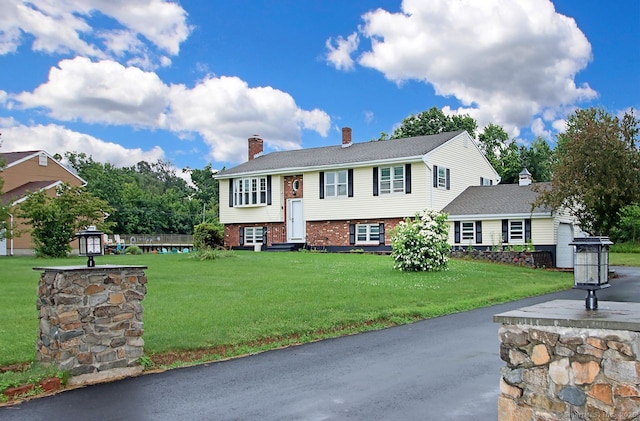 5 Great Meadow Dr, North Haven, CT 06473 - raised ranch with a chimney, brick siding, and a front yard