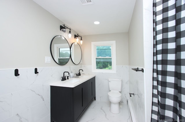 5 Great Meadow Dr, North Haven, CT 06473 - bathroom with tile walls, marble finish flooring, double vanity, a wainscoted wall, and curtained shower