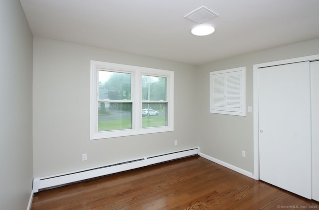 5 Great Meadow Dr, North Haven, CT 06473 - unfurnished bedroom with a baseboard radiator and wood finished floors