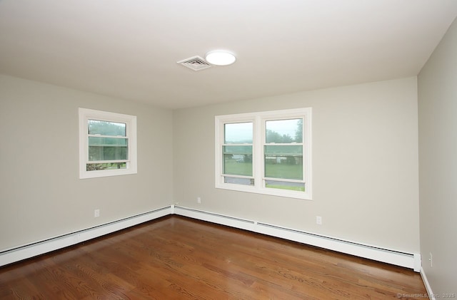 5 Great Meadow Dr, North Haven, CT 06473 - empty room featuring a baseboard heating unit and wood finished floors