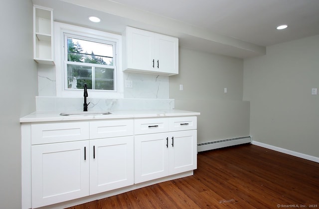5 Great Meadow Dr, North Haven, CT 06473 - kitchen featuring a baseboard heating unit, dark wood-style flooring, white cabinets, decorative backsplash, and recessed lighting