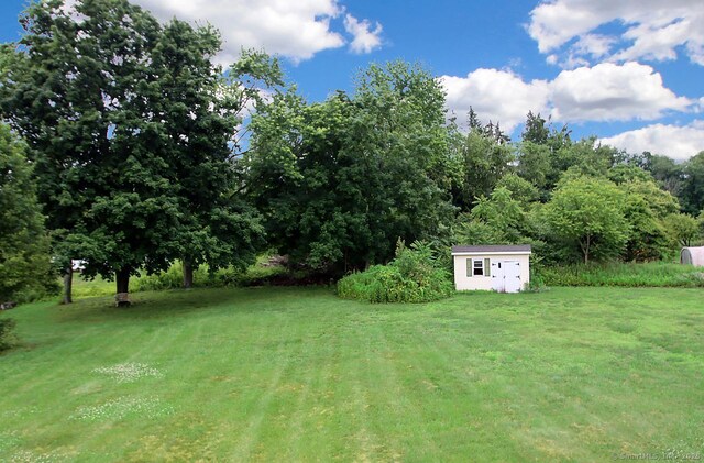5 Great Meadow Dr, North Haven, CT 06473 - view of grassy yard featuring a storage shed