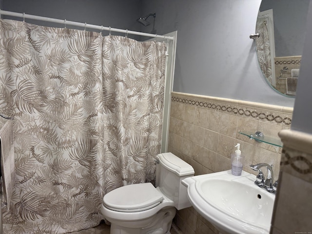 71 Aiken St Apt N7, Norwalk, CT 06851 - full bath with a shower with curtain, tile walls, and a wainscoted wall