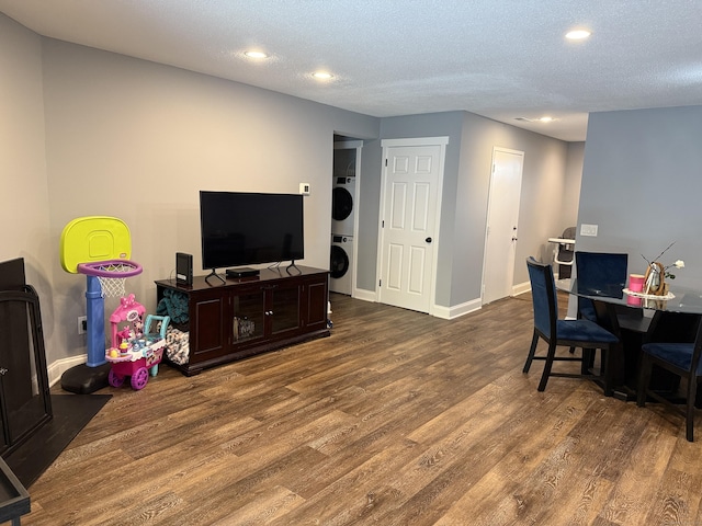 71 Aiken St Apt N7, Norwalk, CT 06851 - office featuring stacked washing machine and dryer, wood finished floors, recessed lighting, and a textured ceiling
