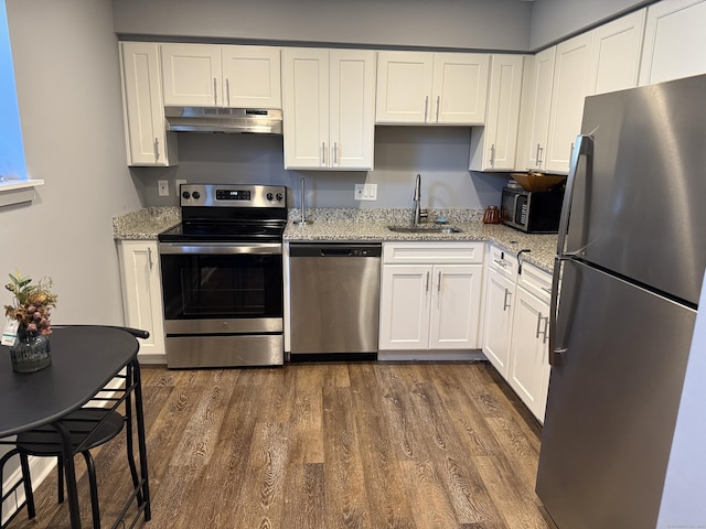 71 Aiken St Apt N7, Norwalk, CT 06851 - kitchen with stainless steel appliances, under cabinet range hood, dark wood-style flooring, and white cabinets
