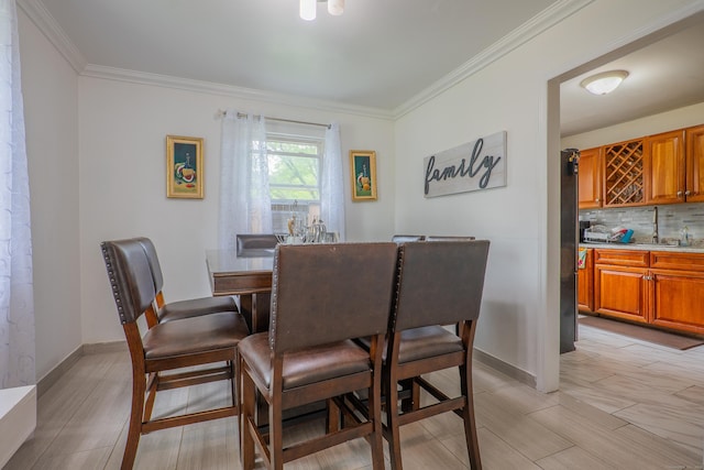 51 Park Ave Unit 2-13, Danbury, CT 06810 - dining area with ornamental molding and bar area