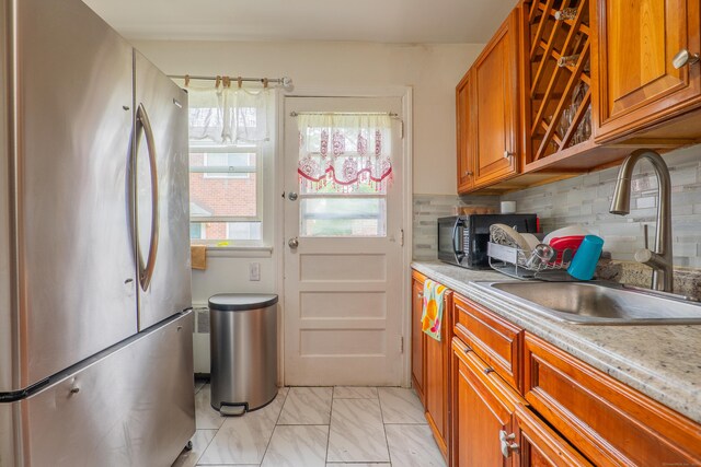 51 Park Ave Unit 2-13, Danbury, CT 06810 - kitchen featuring freestanding refrigerator, black microwave, brown cabinets, and light countertops