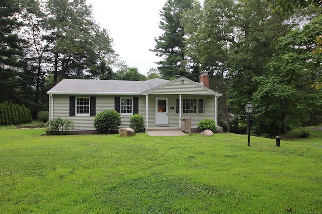 15 Birch Rd, Granby, CT 06035 - view of front of property featuring a front lawn and a chimney