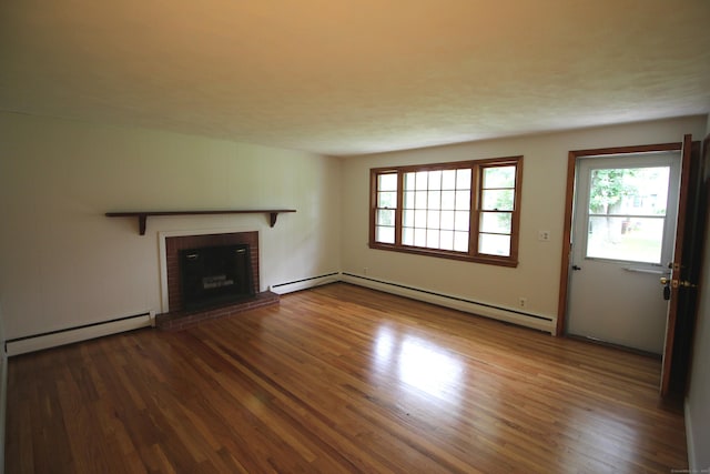 15 Birch Rd, Granby, CT 06035 - unfurnished living room featuring a baseboard radiator, wood finished floors, and healthy amount of natural light