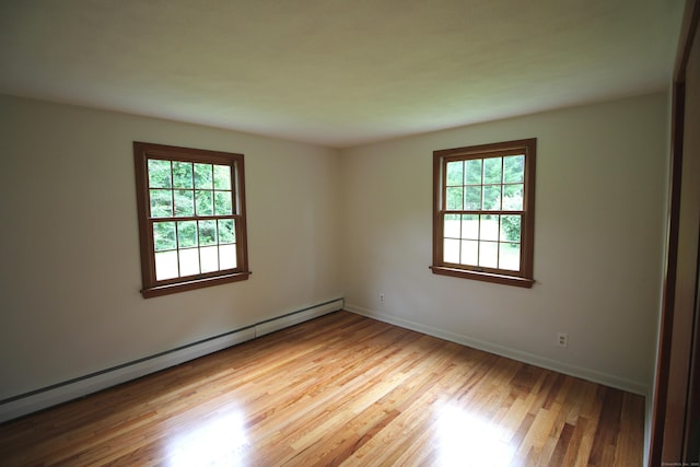 15 Birch Rd, Granby, CT 06035 - unfurnished room featuring baseboard heating, healthy amount of natural light, and wood finished floors