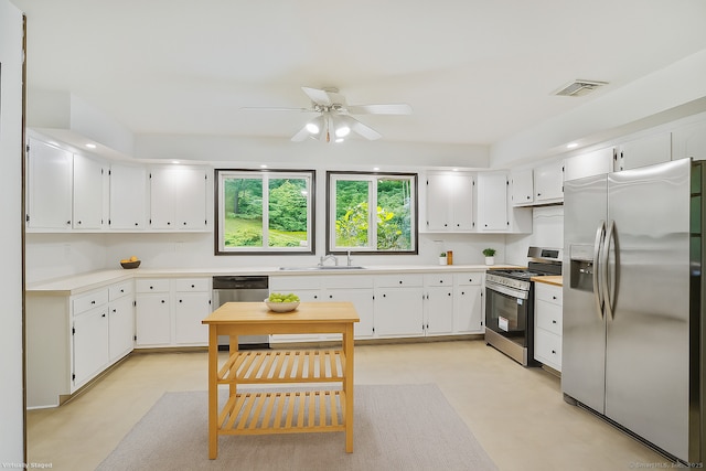 256 W Rocks Rd, Norwalk, CT 06851 - kitchen with stainless steel appliances, a ceiling fan, light countertops, and white cabinets