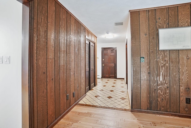 256 W Rocks Rd, Norwalk, CT 06851 - hall featuring light wood finished floors and wood walls