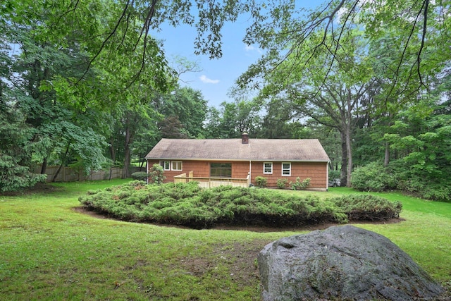 256 W Rocks Rd, Norwalk, CT 06851 - rear view of house featuring a chimney and a deck