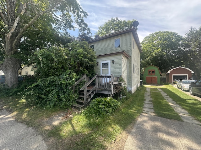 117 State Ave, Killingly, CT 06241 - view of front of home featuring an outbuilding, driveway, and a detached garage