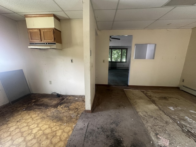 117 State Ave, Killingly, CT 06241 - unfurnished room with a drop ceiling, a baseboard heating unit, and ceiling fan