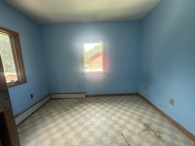 117 State Ave, Killingly, CT 06241 - empty room featuring a baseboard heating unit