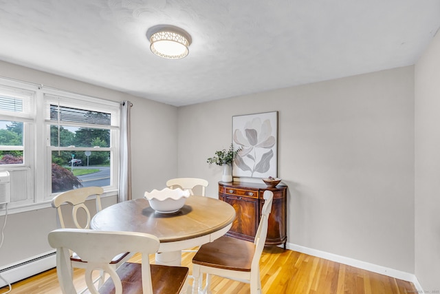 45 Neelans Rd, Enfield, CT 06082 - dining room with light wood-style flooring and a baseboard heating unit