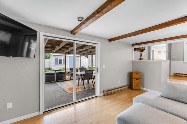 45 Neelans Rd, Enfield, CT 06082 - living room with a baseboard heating unit, wood finished floors, beamed ceiling, and a baseboard radiator