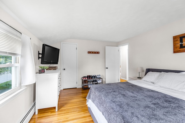 45 Neelans Rd, Enfield, CT 06082 - bedroom featuring a baseboard radiator, light wood-type flooring, and vaulted ceiling