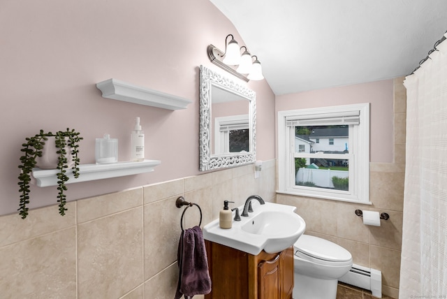 45 Neelans Rd, Enfield, CT 06082 - full bath with baseboard heating, tile walls, vanity, a shower with shower curtain, and wainscoting