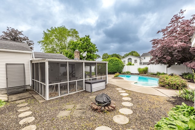 45 Neelans Rd, Enfield, CT 06082 - fenced backyard featuring a sunroom and a fire pit