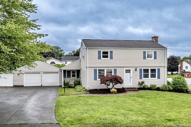 45 Neelans Rd, Enfield, CT 06082 - colonial house featuring an outdoor structure, a chimney, a garage, and a front lawn