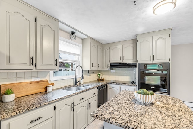 45 Neelans Rd, Enfield, CT 06082 - kitchen featuring black appliances, under cabinet range hood, decorative backsplash, and light stone countertops