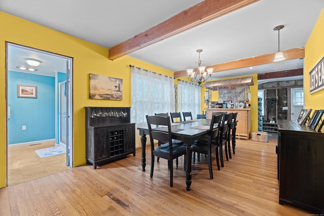 1092 Durham Rd, Guilford, CT 06437 - dining space featuring a chandelier, wood finished floors, and beam ceiling