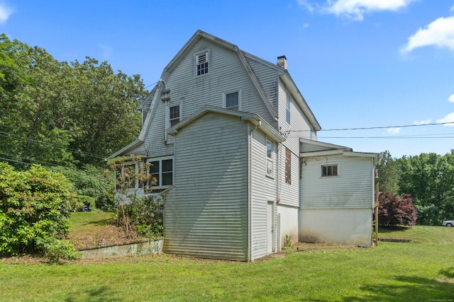 1092 Durham Rd, Guilford, CT 06437 - view of side of home with a chimney, a yard, and a gambrel roof