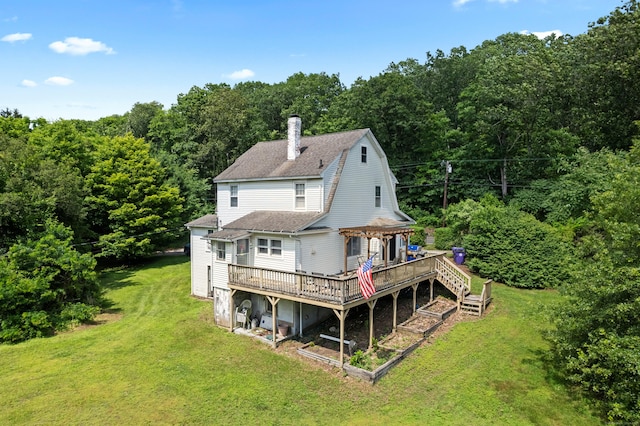 1092 Durham Rd, Guilford, CT 06437 - back of property with a wooden deck, a chimney, a pergola, a lawn, and roof with shingles