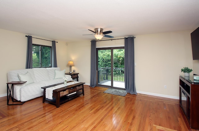 140 Thompson St Apt 16A, East Haven, CT 06513 - living area with a ceiling fan and light wood-style flooring