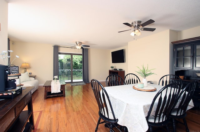 140 Thompson St Apt 16A, East Haven, CT 06513 - dining space featuring a ceiling fan and wood finished floors