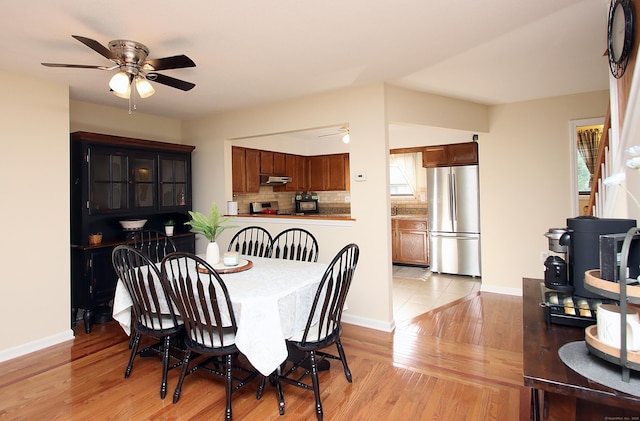 140 Thompson St Apt 16A, East Haven, CT 06513 - dining room featuring a ceiling fan and light wood finished floors