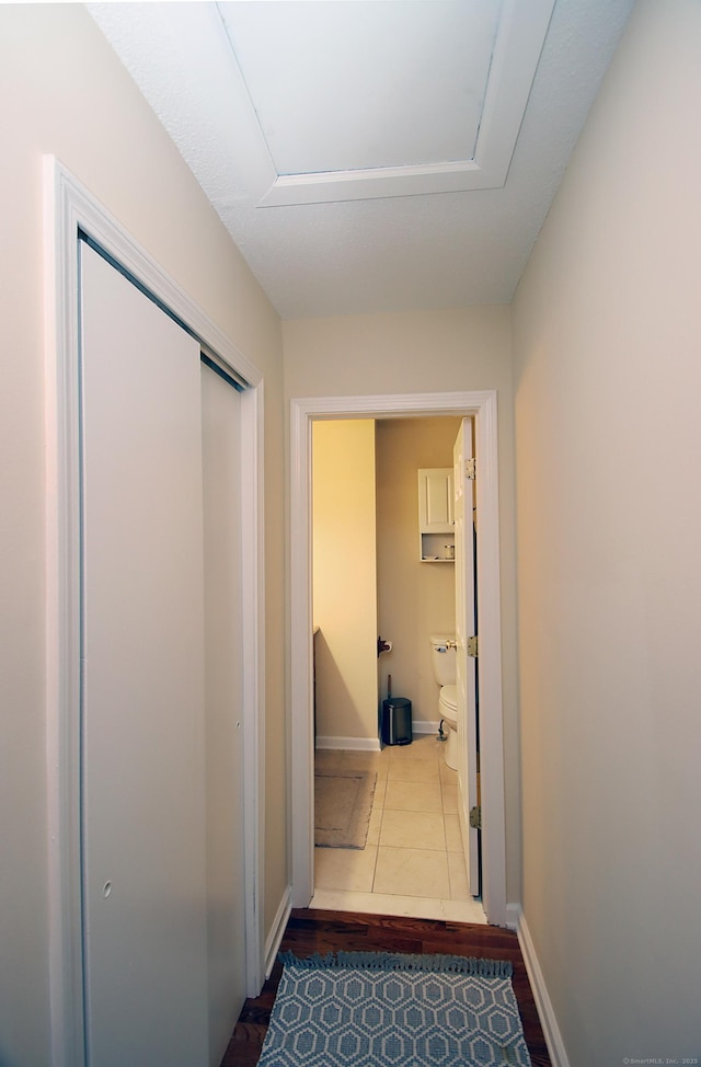 140 Thompson St Apt 16A, East Haven, CT 06513 - corridor with baseboards and wood finished floors