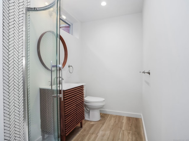 8 Platt St, Norwalk, CT 06855 - bathroom featuring vanity, wood finished floors, and recessed lighting