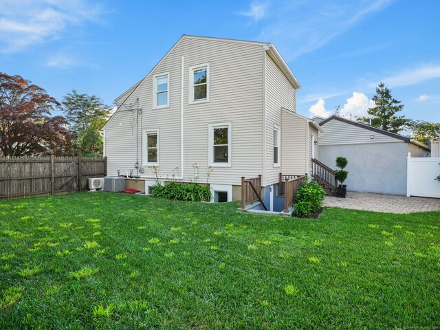 8 Platt St, Norwalk, CT 06855 - back of house with a fenced backyard and a patio area
