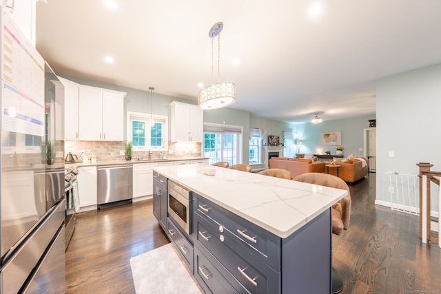 15 Contour Dr, Cheshire, CT 06410 - kitchen with stainless steel appliances, white cabinets, backsplash, dark wood finished floors, and recessed lighting
